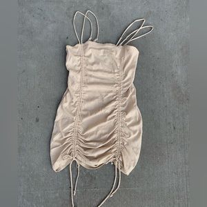 Beige dress with a frill on laces